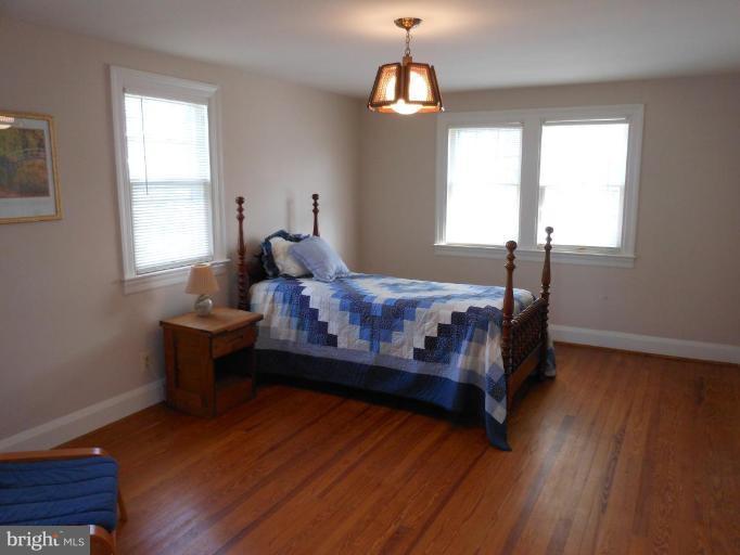 616 North Bend Road Baltimore, MD 21229 - Photo 9 of 18 a bedroom with a bed and window