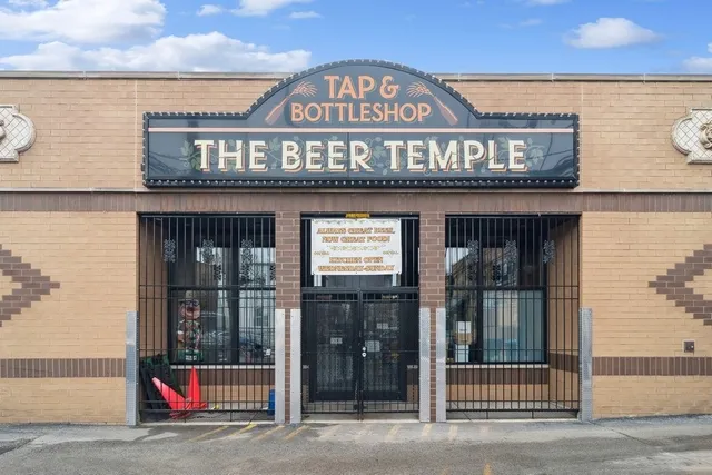 a view of a building with retail shops