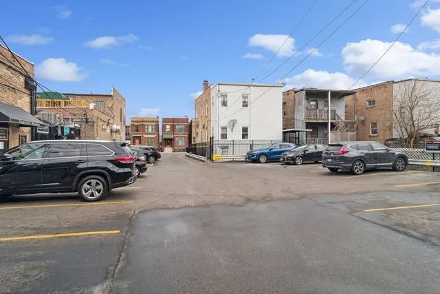a view of a cars parked in front of a building