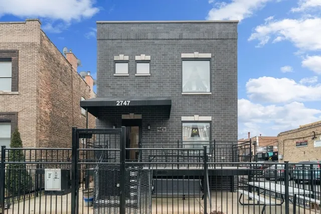 a front view of a house with glass windows