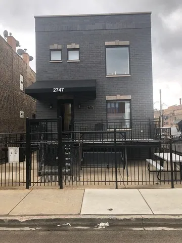 a building outdoor space with a car parked