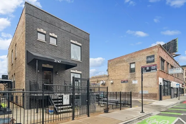 a front view of a building with glass windows