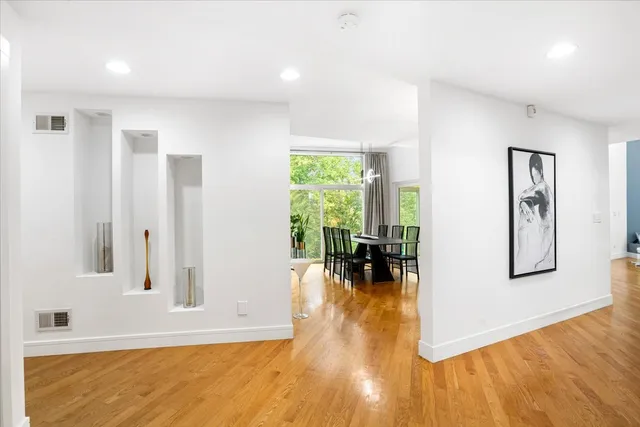 a view of kitchen with furniture and wooden floor