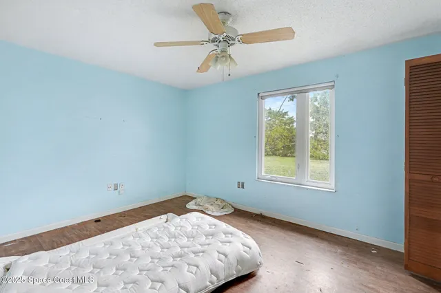 a white toilet sitting next to a bathroom sink and a shower