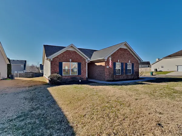 a front view of a house with yard