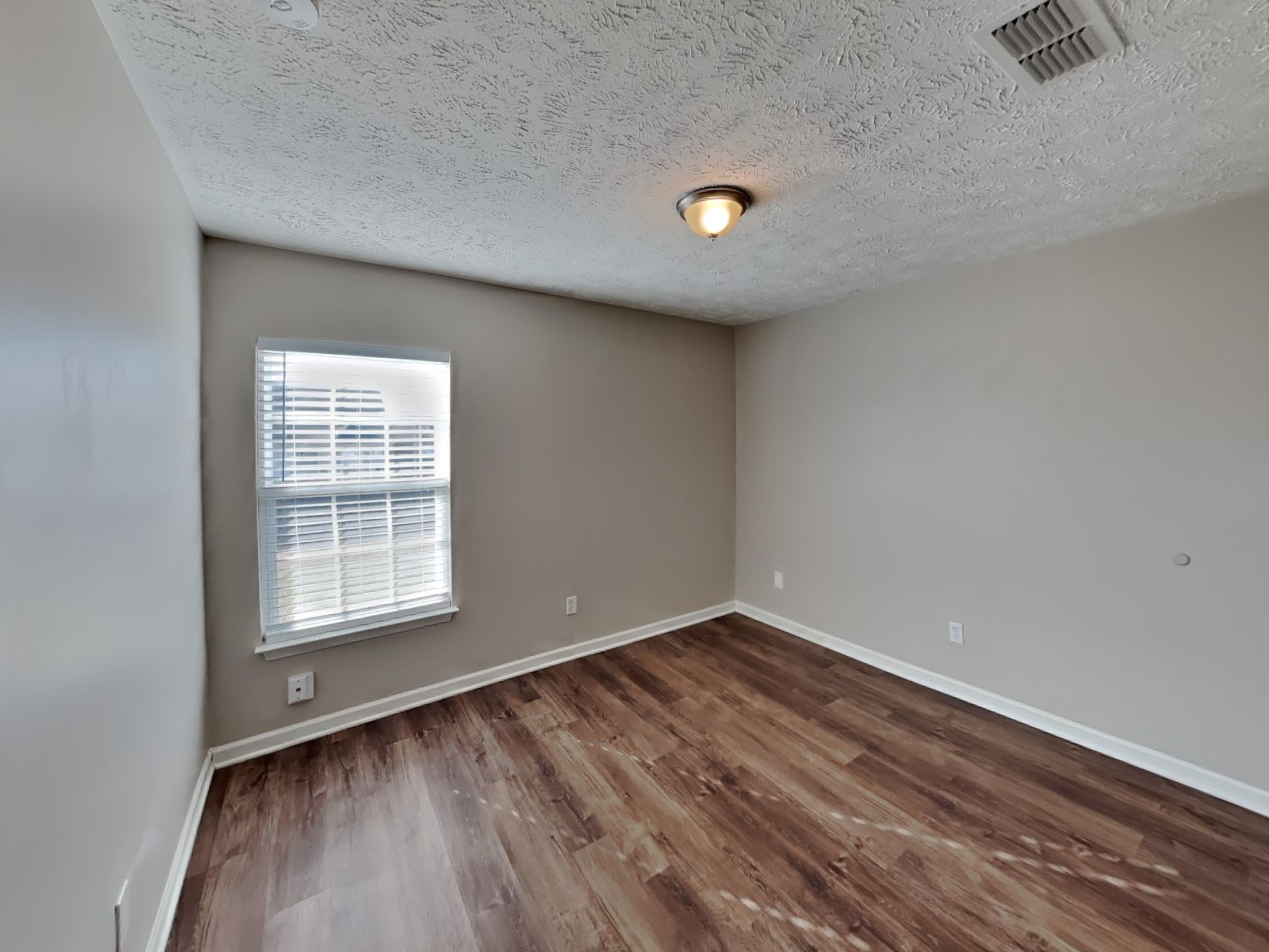 4049 Sequoia Trail Spring Hill, TN 37174 - Photo 13 of 15 an empty room with wooden floor and windows