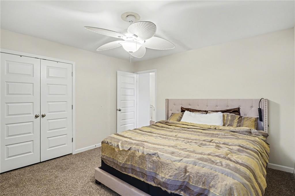 1241 England Terrace Hampton, GA 30228 - Photo 16 of 20 a bedroom with a bed and closet