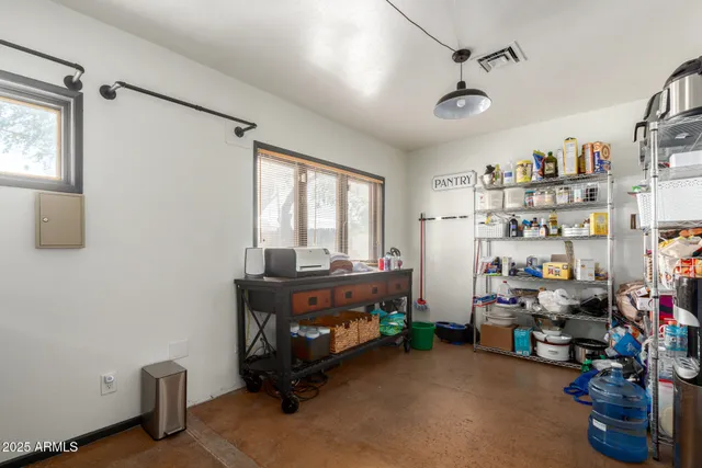 a bedroom with furniture and a fireplace