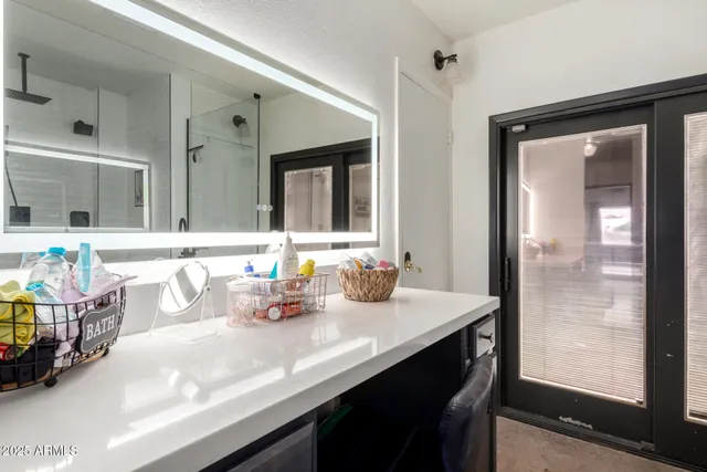 a kitchen with a refrigerator and a sink