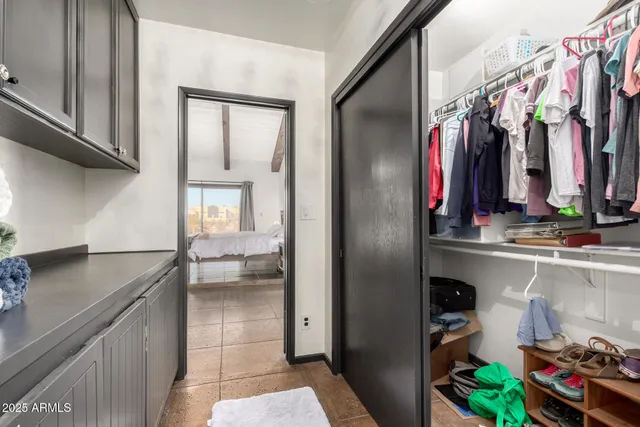 a view of patio with table and chairs and potted plants