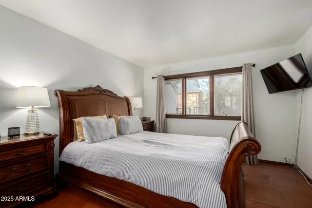 a bathroom with a sink mirror and a window