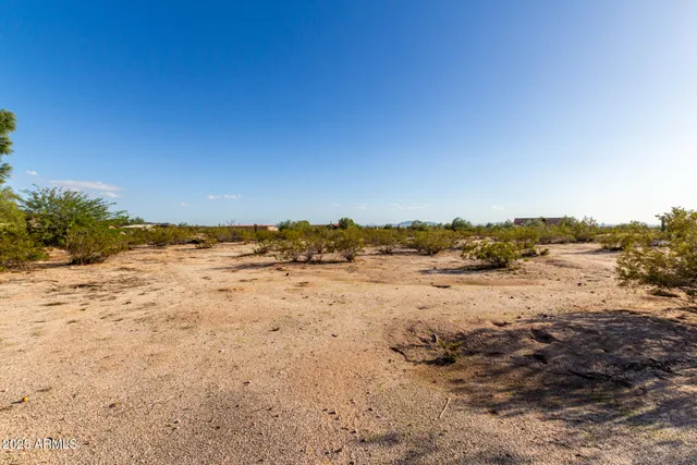 an aerial view of a house with yard swimming pool and outdoor seating