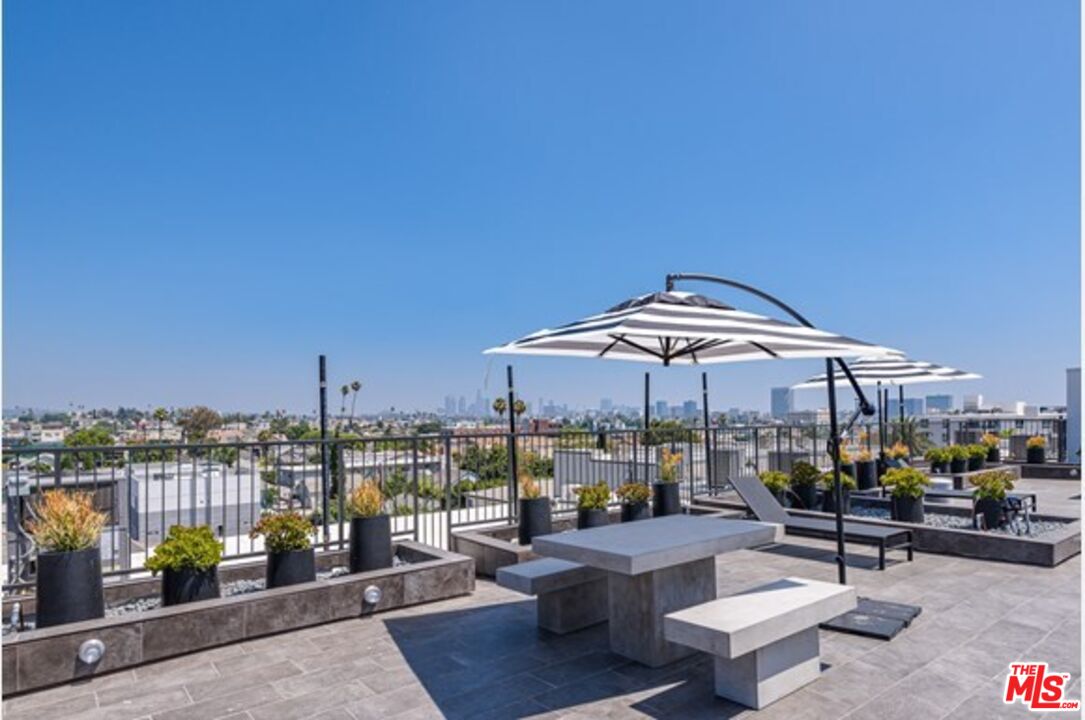 518 North Gramercy Place, Unit PH1 Los Angeles, CA 90004 - Photo 3 of 13 a view of a terrace with chairs