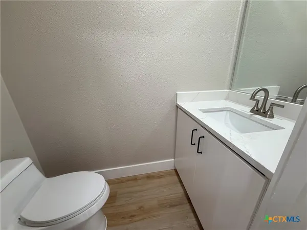 a bathroom with a sink and toilet