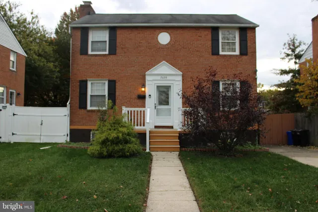 a kitchen with a wooden floor and a stove top oven