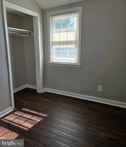 a view of a house with a wooden deck