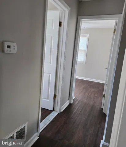 a view of backyard of house with green space