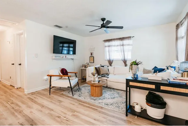 a living room with furniture and a window
