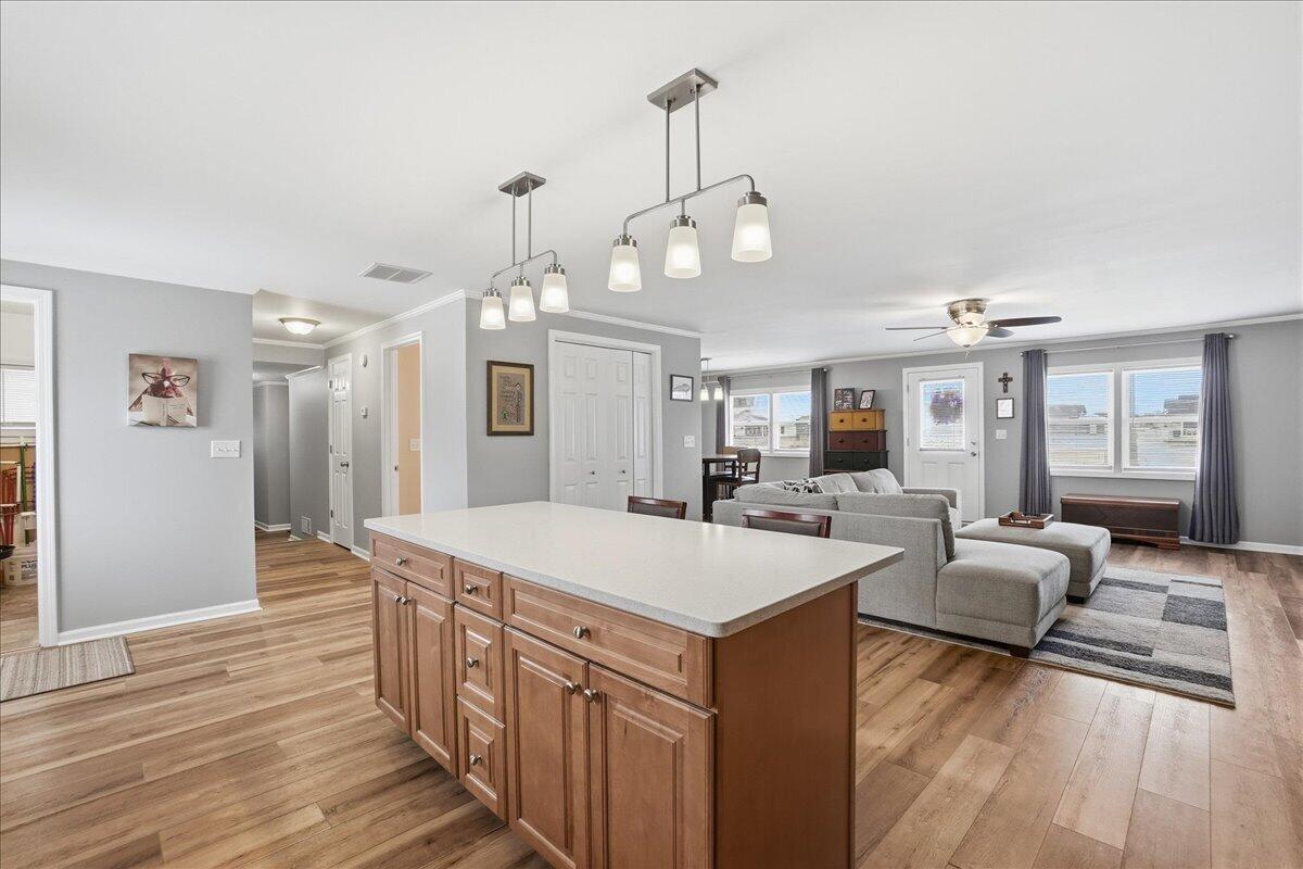 18311 Clark Street Lowell, IN 46356 - Photo 11 of 36 a large kitchen with sink a counter top space and stainless steel appliances