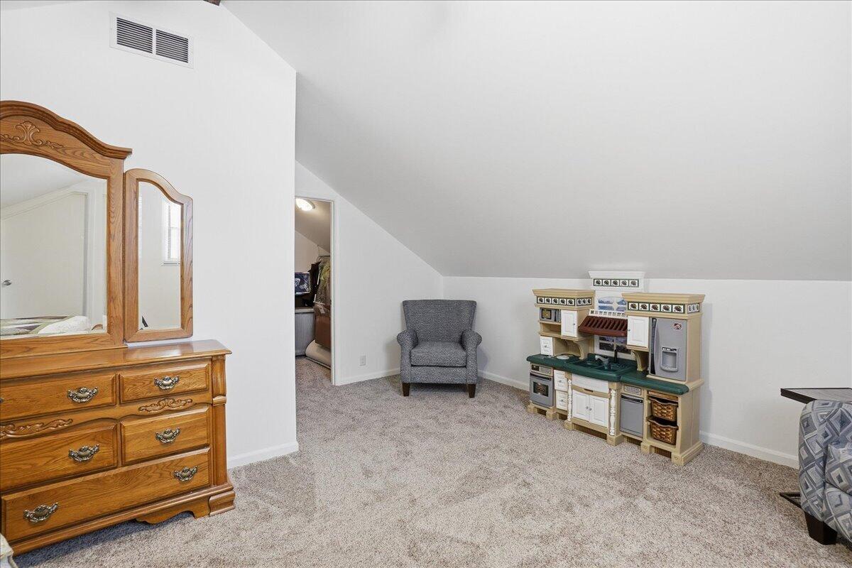 18311 Clark Street Lowell, IN 46356 - Photo 27 of 36 a living room with furniture and a flat screen tv