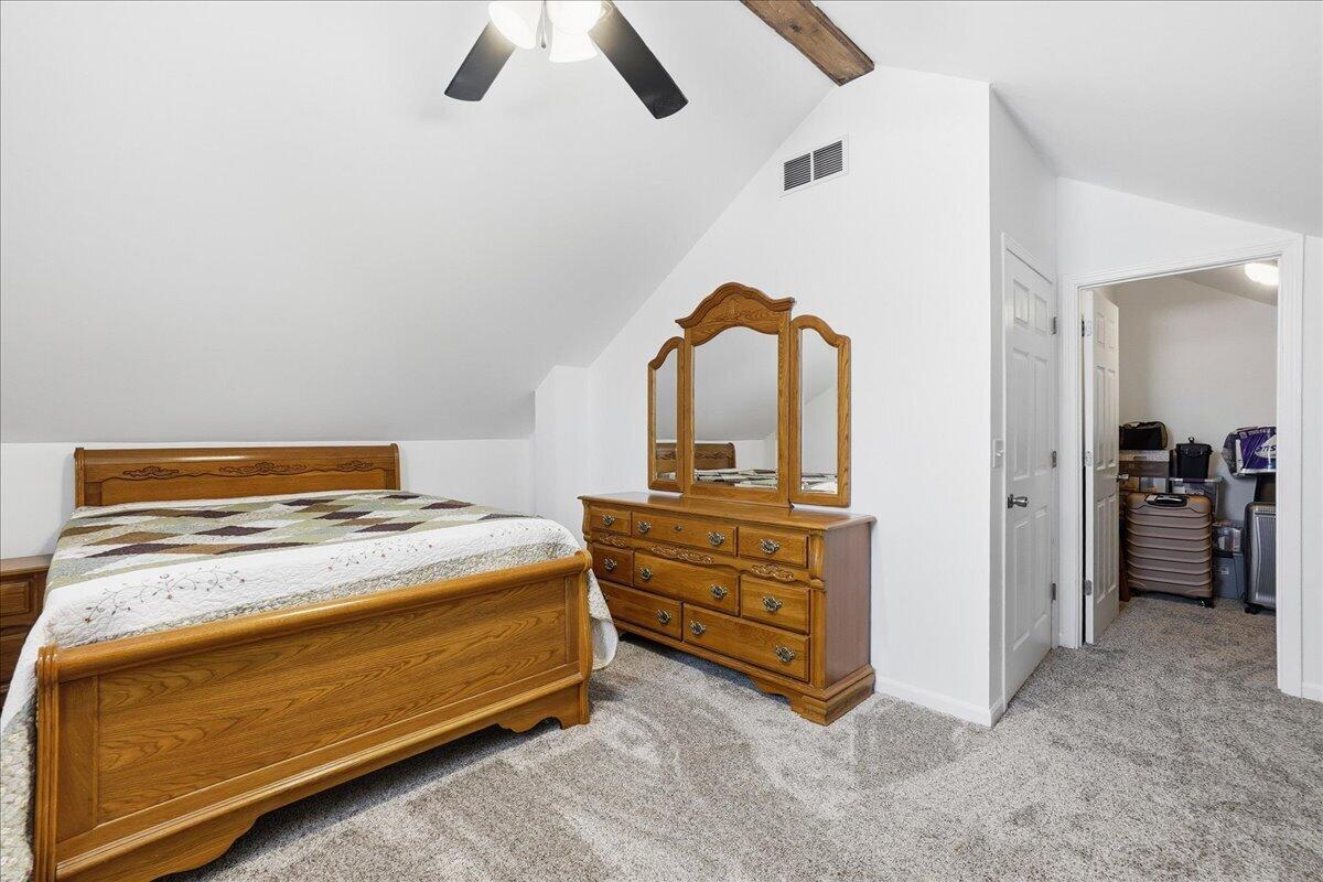 18311 Clark Street Lowell, IN 46356 - Photo 28 of 36 a bed room with a bed and a mirror
