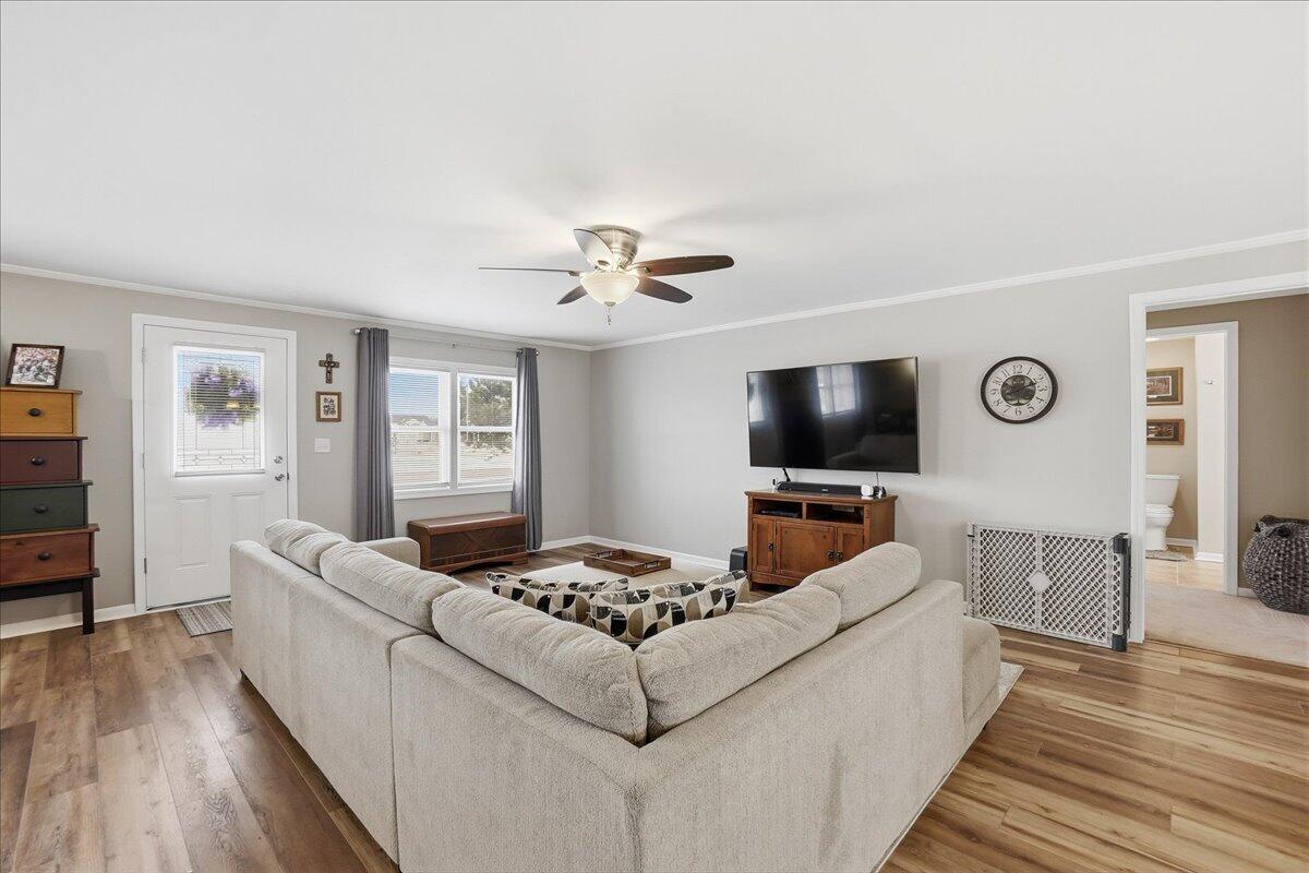 18311 Clark Street Lowell, IN 46356 - Photo 9 of 36 a living room with furniture and a flat screen tv