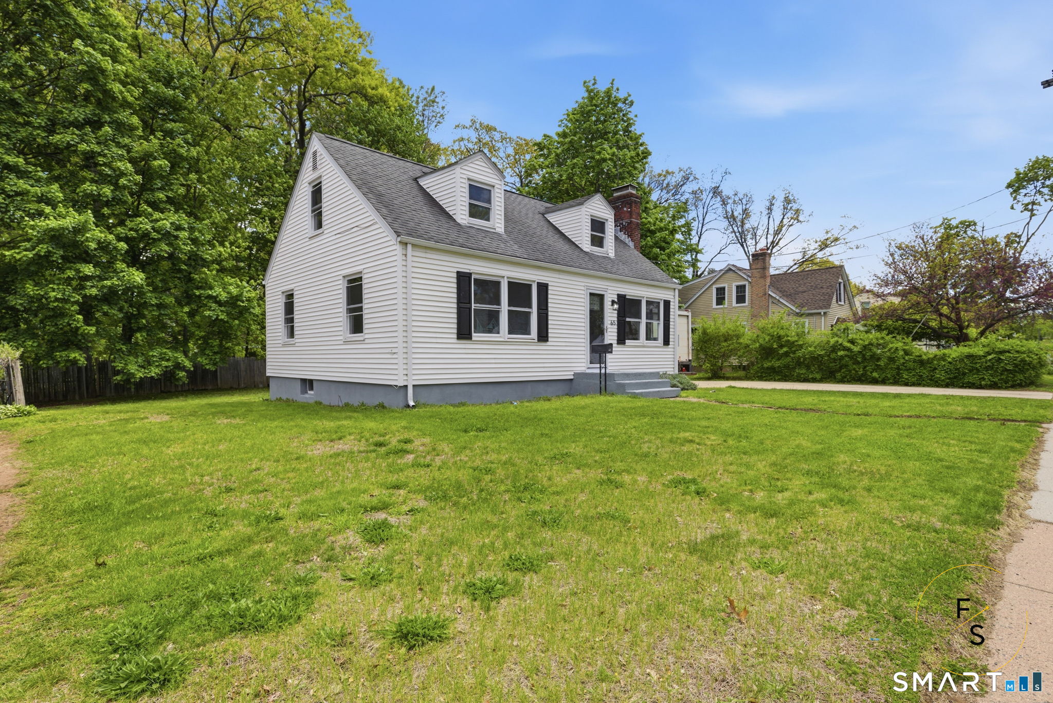 65 Broad Street Manchester, CT 06042 - Photo 2 of 40 a view of a house with a yard