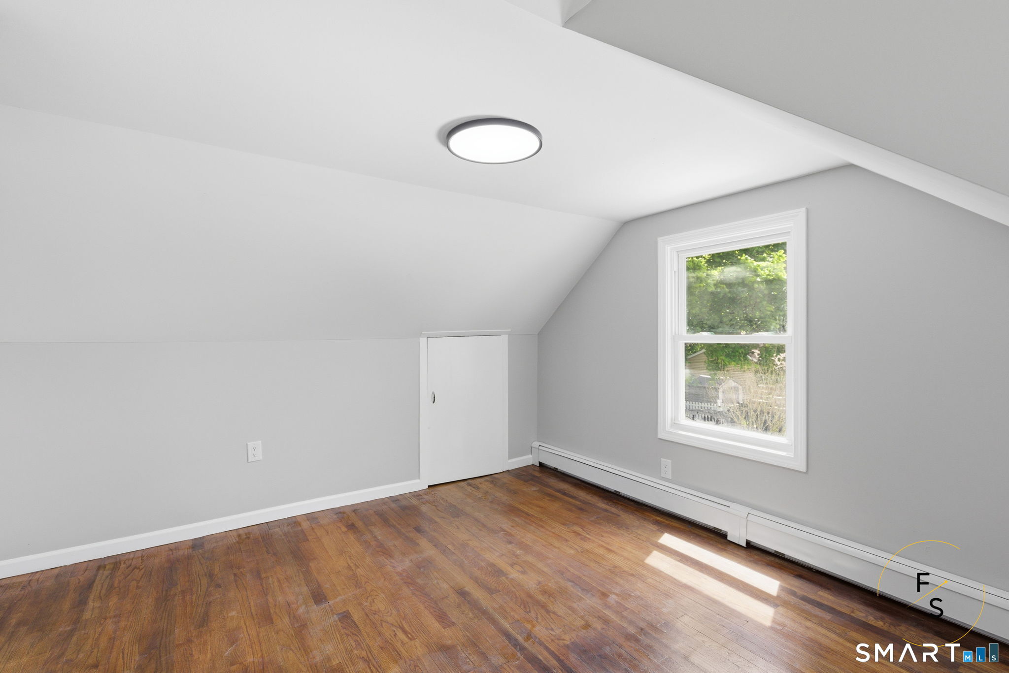 65 Broad Street Manchester, CT 06042 - Photo 23 of 40 an empty room with wooden floor and windows