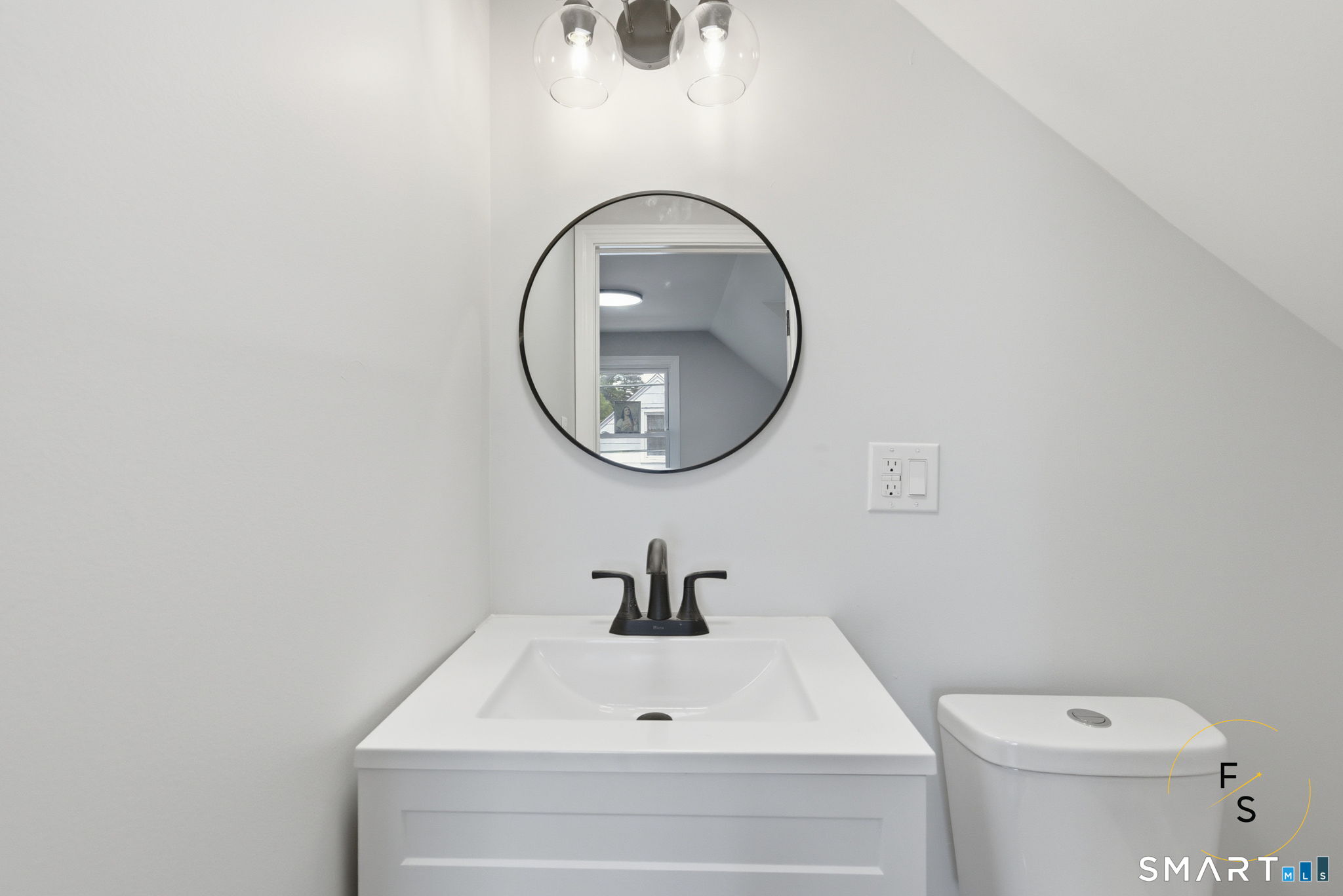 65 Broad Street Manchester, CT 06042 - Photo 27 of 40 a bathroom with a sink and a mirror