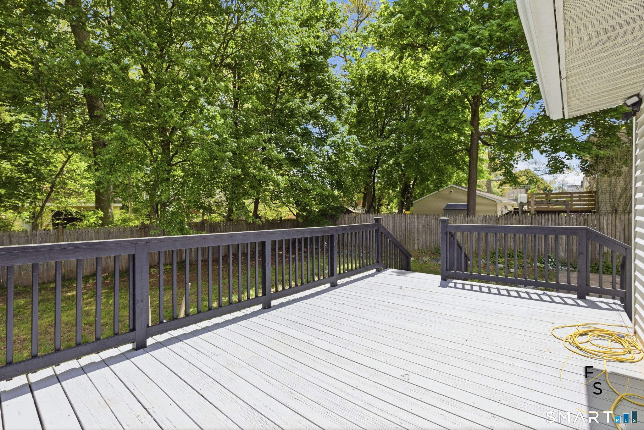 65 Broad Street Manchester, CT 06042 - Photo 32 of 40 a view of balcony with wooden floor and fence