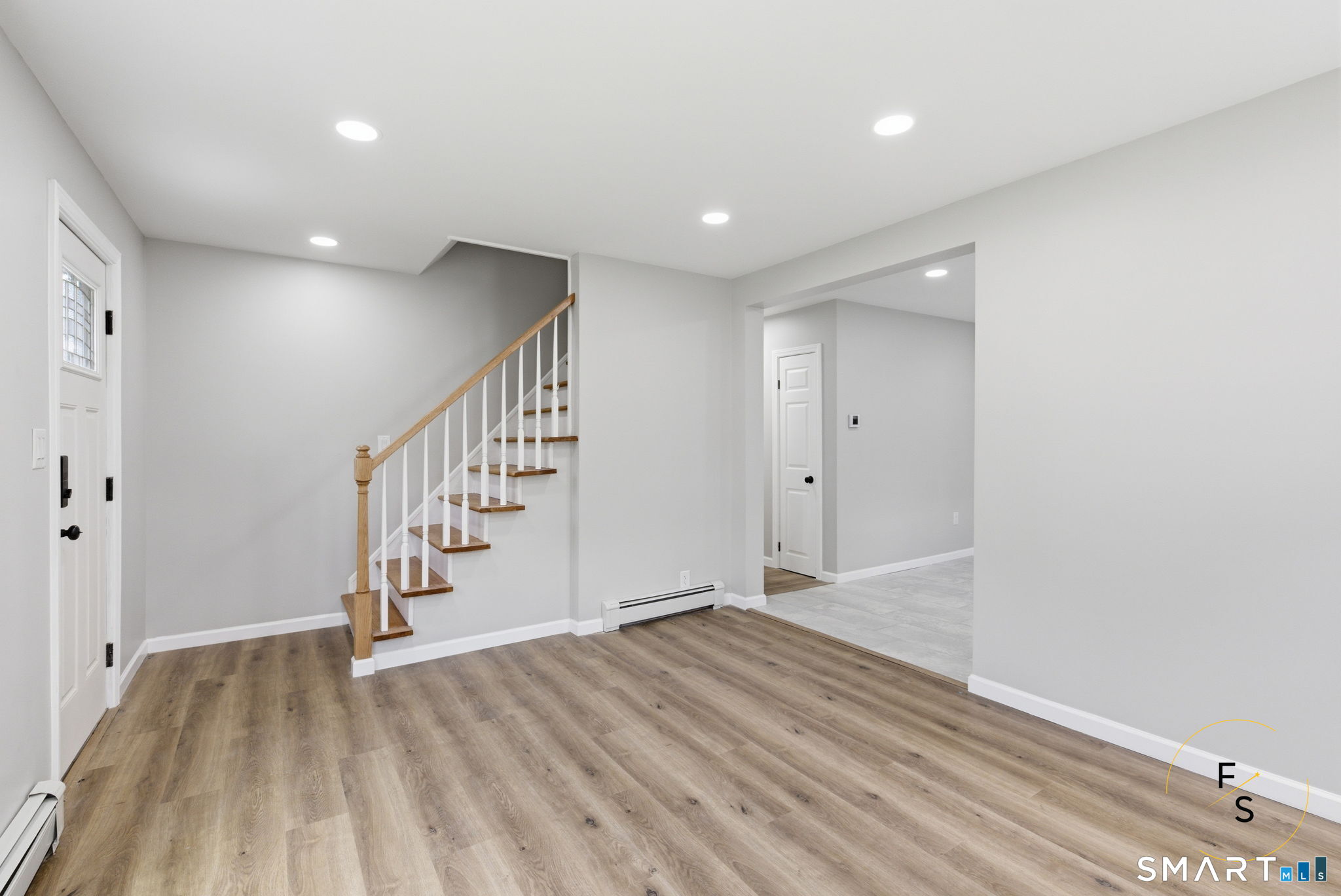 65 Broad Street Manchester, CT 06042 - Photo 6 of 40 a view of entryway with wooden floor