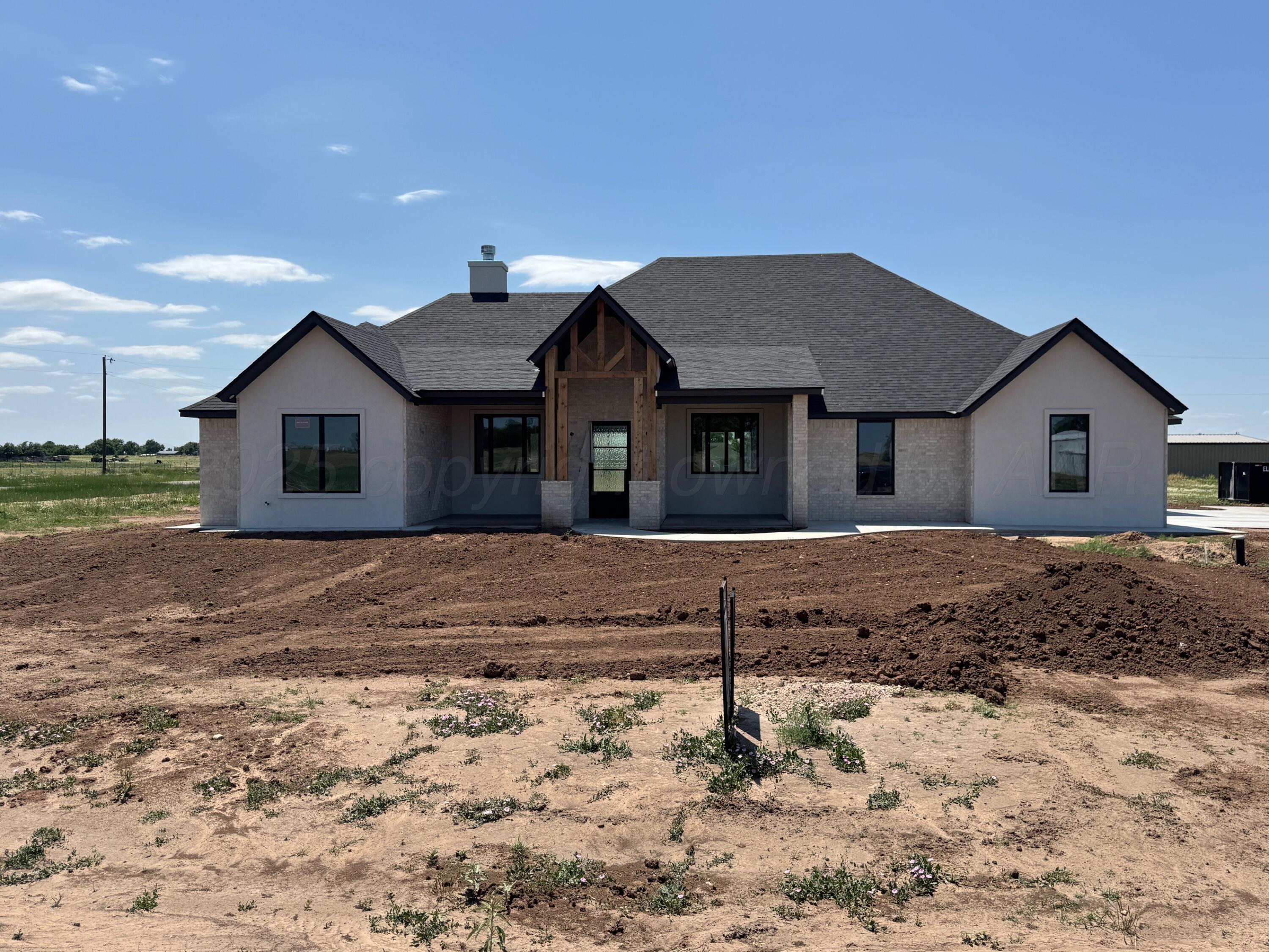 25250 High Plains Road Briscoe, TX 79011 - Photo 1 of 6 a front view of a house with a yard