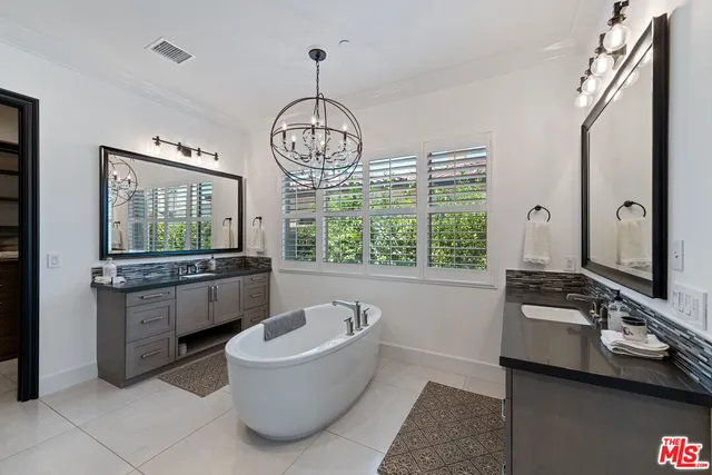 a large spacious bathroom with a large tub and sink