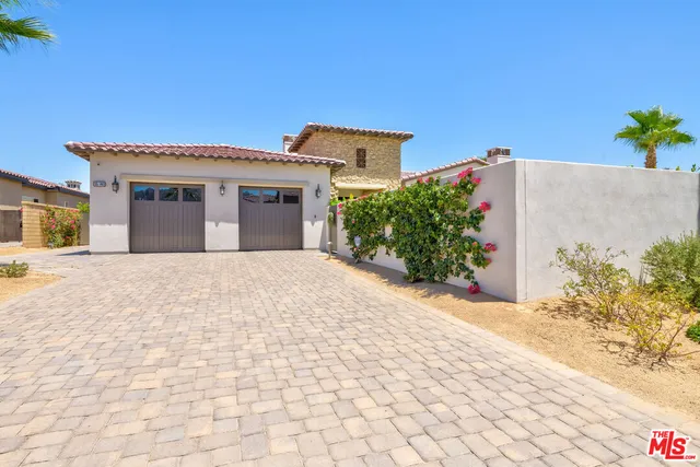 a view of house with patio outdoor and entertaining space