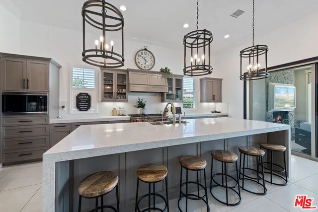 a kitchen with a dining table and chairs