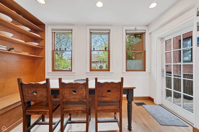 a dining room with furniture and window