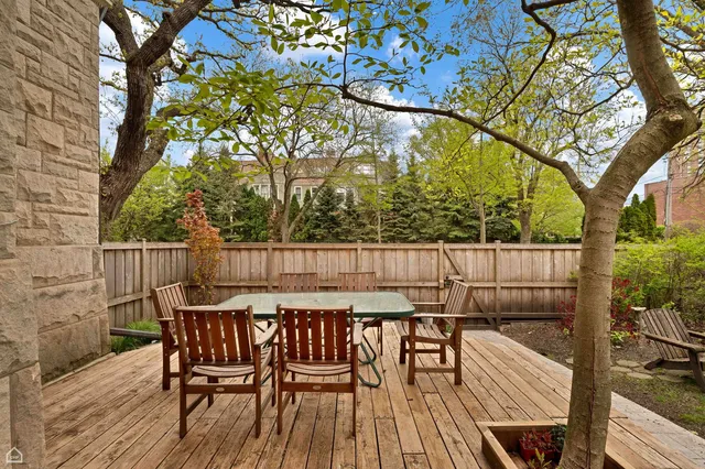 a view of balcony with wooden floor and outdoor seating