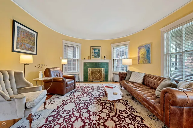 a living room with furniture or couch and a fireplace