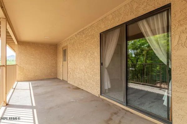 a view of a room with a large window