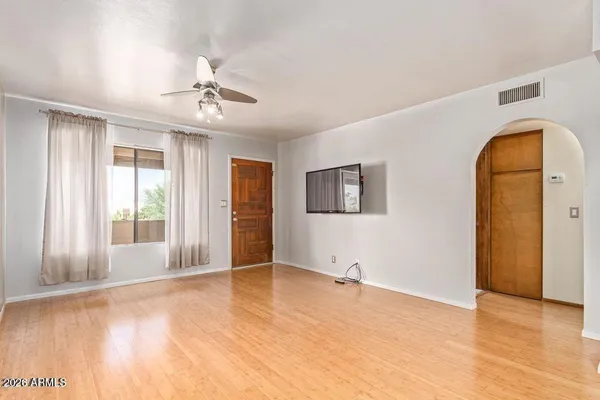 a view of an empty room with a window