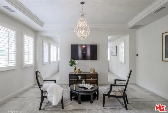 a view of a dining room with furniture and window