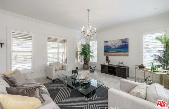 a living room with furniture or couch and a large window