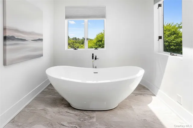 a bathroom with a sink a mirror and a shower