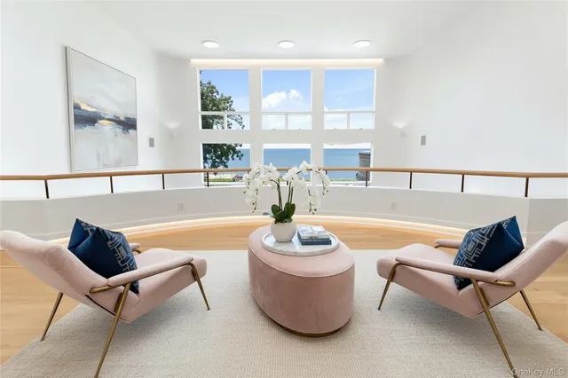 a spacious bedroom with a bed and wooden floor
