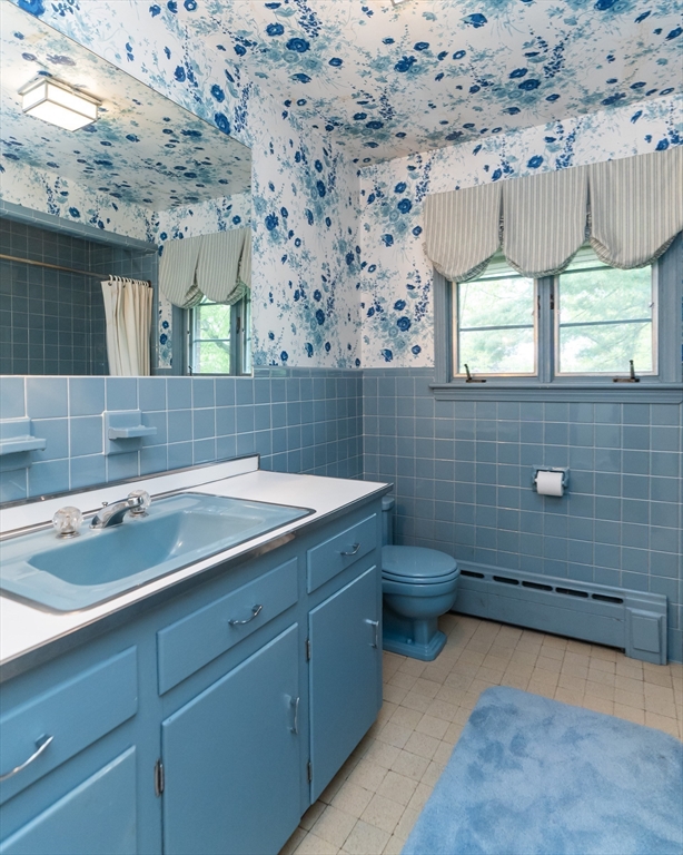 35 Squire Lane Springfield, MA 01118 - Photo 15 of 28 a bathroom with a sink and a toilet