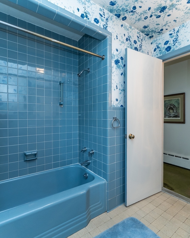 35 Squire Lane Springfield, MA 01118 - Photo 16 of 28 a bathroom with a bathtub and a shower