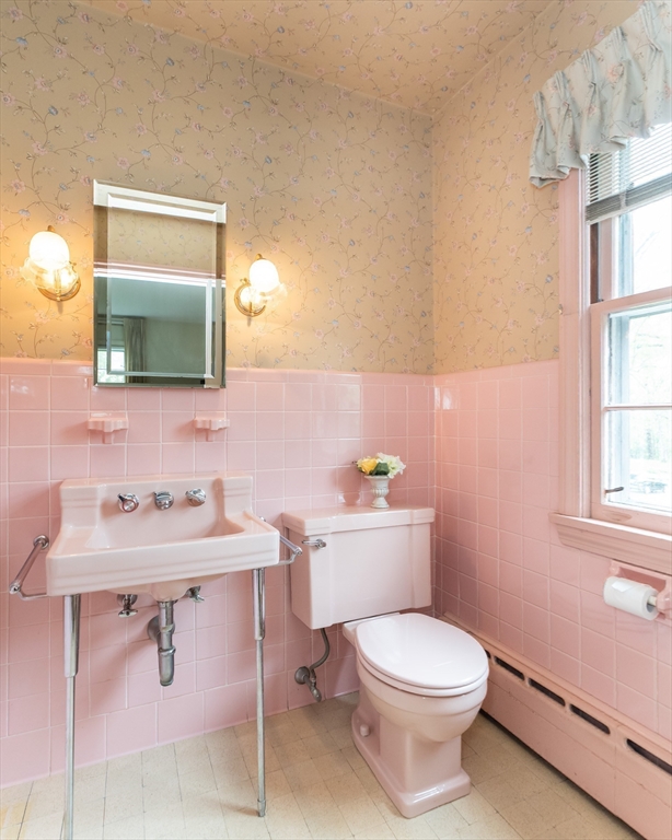 35 Squire Lane Springfield, MA 01118 - Photo 18 of 28 a bathroom with a toilet a sink and mirror