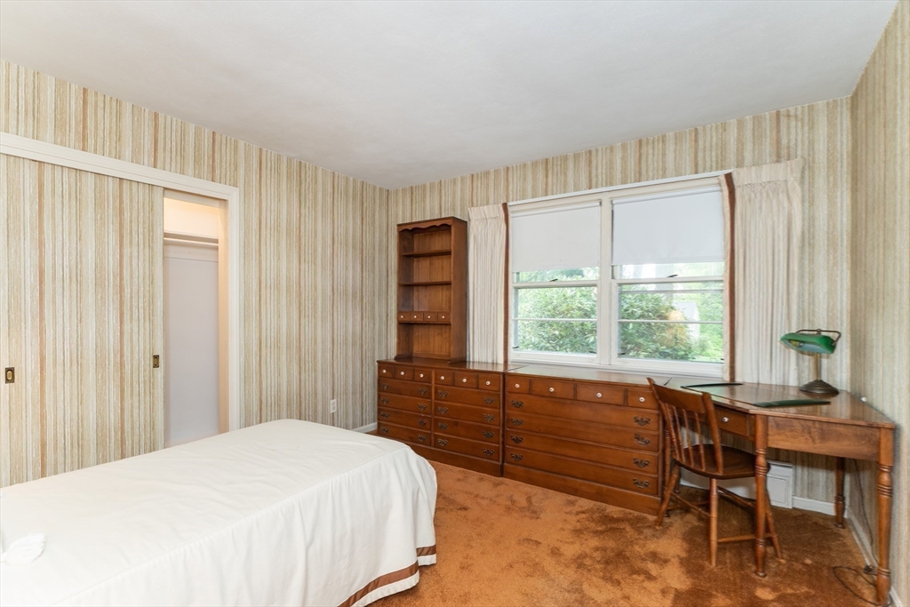 35 Squire Lane Springfield, MA 01118 - Photo 23 of 28 a bedroom with a bed and a large window