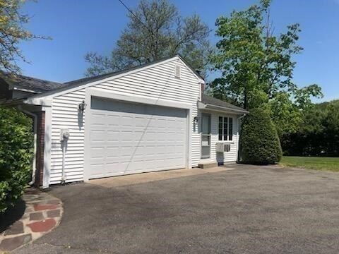 35 Squire Lane Springfield, MA 01118 - Photo 26 of 28 a front view of a house with a garage