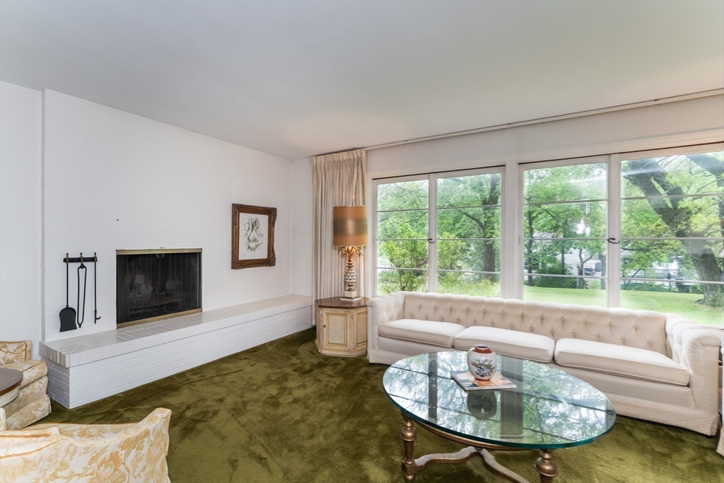 35 Squire Lane Springfield, MA 01118 - Photo 3 of 28 a living room with furniture and a fireplace